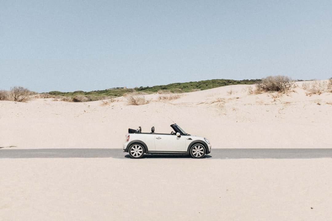 convertible coupe in middle of road